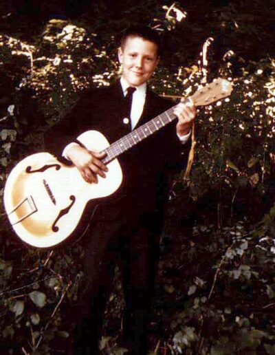 Howard at 6 years, with his first guitar